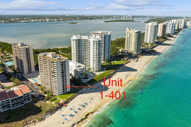 bird's eye view featuring a water view and a view of the beach