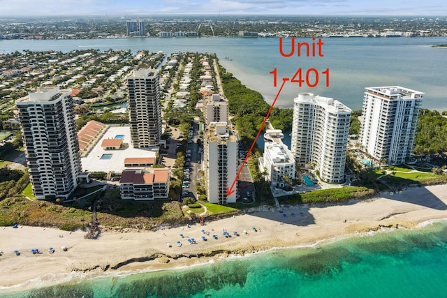 drone / aerial view with a view of the beach and a water view