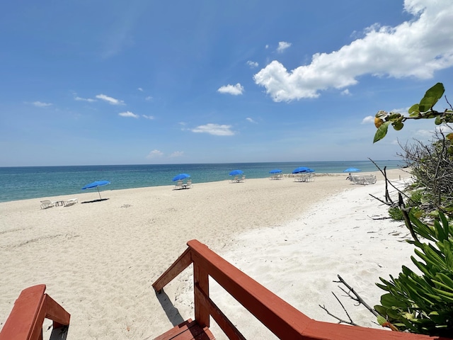 property view of water featuring a beach view