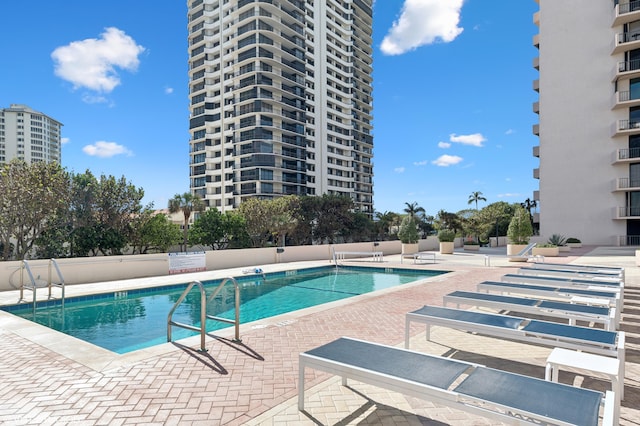 view of swimming pool featuring a patio area