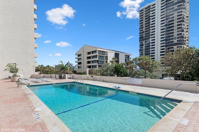 view of swimming pool featuring a patio area