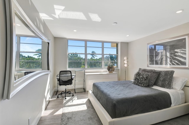 bedroom with light hardwood / wood-style flooring