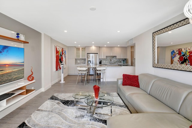 living room with light hardwood / wood-style flooring