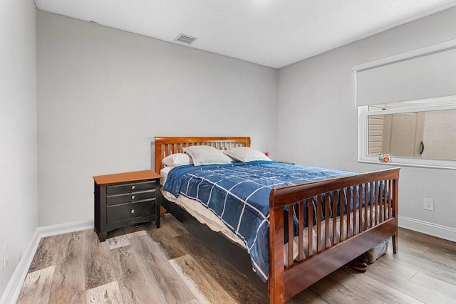 bedroom featuring wood-type flooring