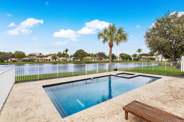 view of pool with a water view and a patio