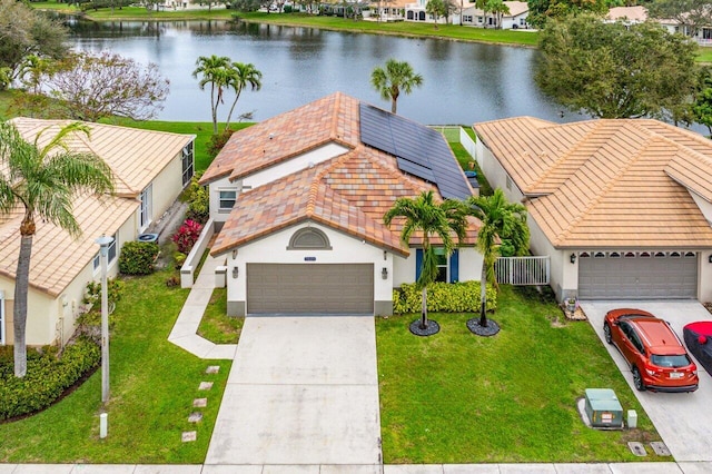 drone / aerial view with a water view