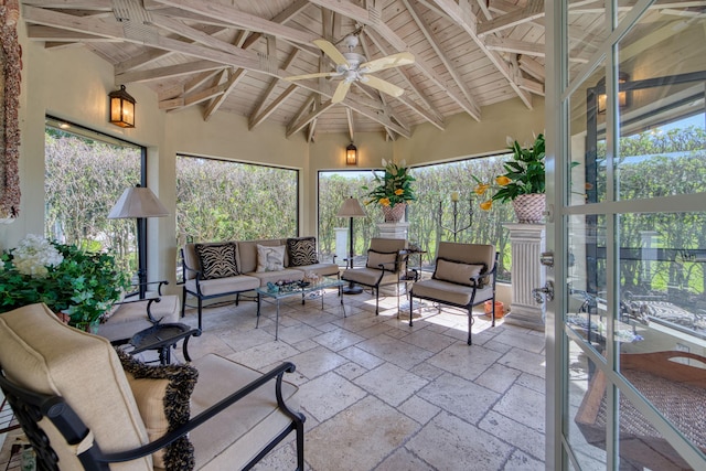 sunroom / solarium with beam ceiling, ceiling fan, and wood ceiling