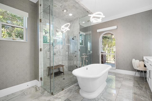 bathroom featuring baseboards, wallpapered walls, a freestanding tub, a shower stall, and marble finish floor