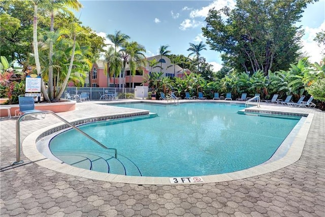 view of swimming pool with a patio area