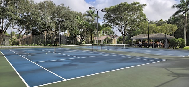 view of tennis court featuring a gazebo and basketball court