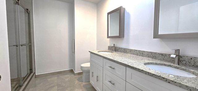 bathroom featuring walk in shower, tile patterned floors, vanity, and toilet