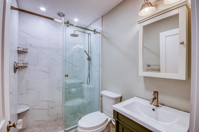 bathroom featuring vanity, toilet, and a shower with door