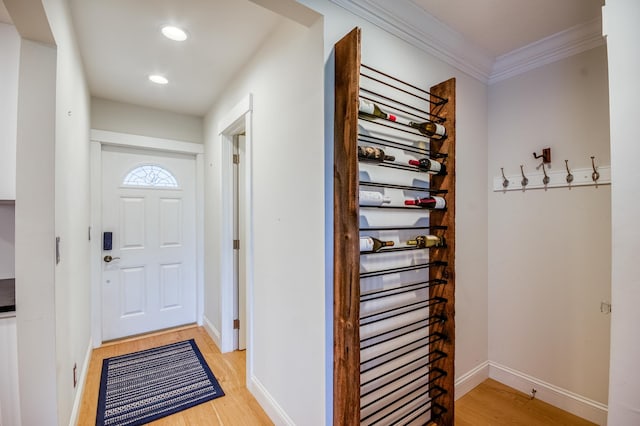 interior space featuring hardwood / wood-style flooring and ornamental molding