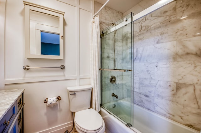 full bathroom with vanity, shower / tub combo, and toilet