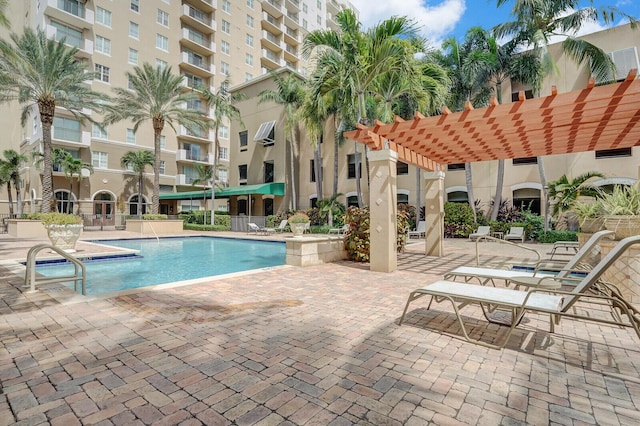 view of pool featuring a pergola and a patio area