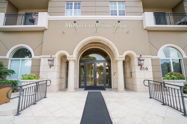 view of exterior entry featuring french doors