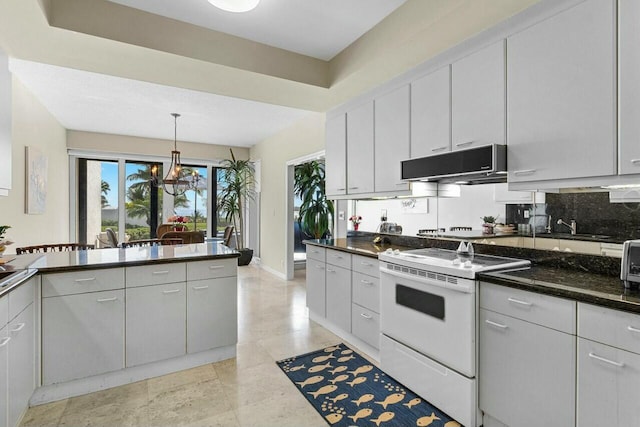 kitchen featuring electric stove, pendant lighting, white cabinetry, backsplash, and dark stone counters