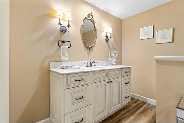 bathroom with vanity and wood-type flooring