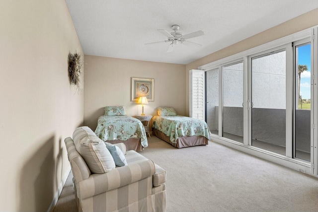 carpeted bedroom featuring multiple windows, access to outside, and ceiling fan