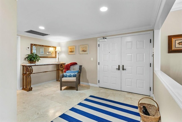 foyer entrance featuring crown molding