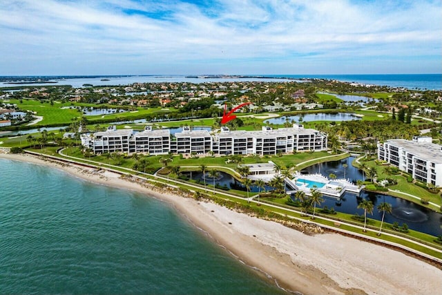 drone / aerial view with a view of the beach and a water view