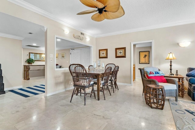 dining room with ornamental molding, ceiling fan, and a textured ceiling