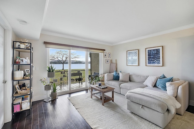 living room with crown molding, hardwood / wood-style flooring, and a water view