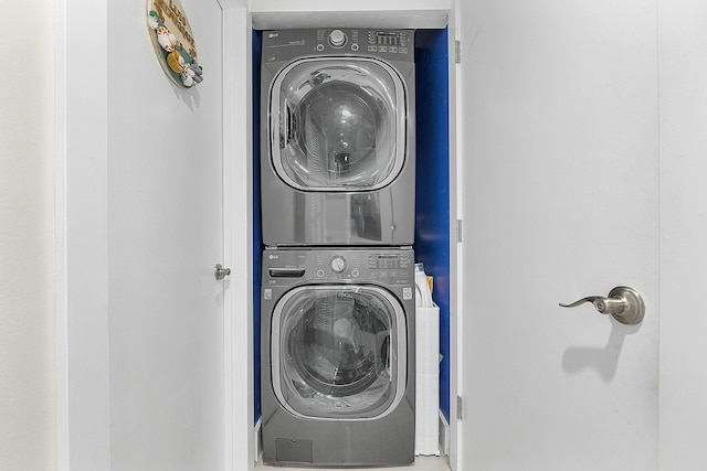 clothes washing area with stacked washer / drying machine