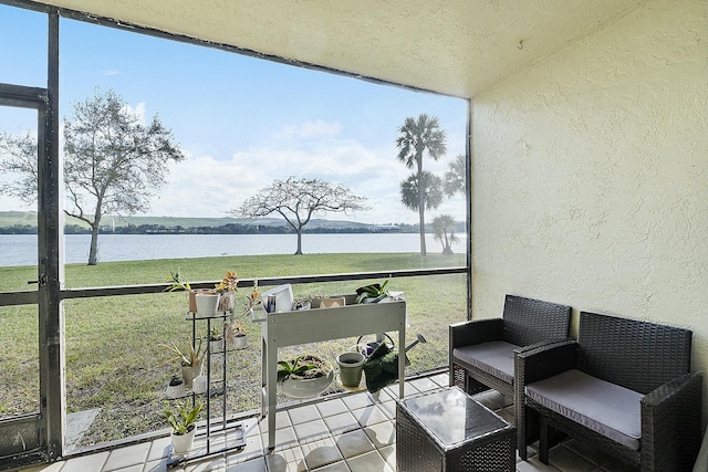 sunroom with a water view