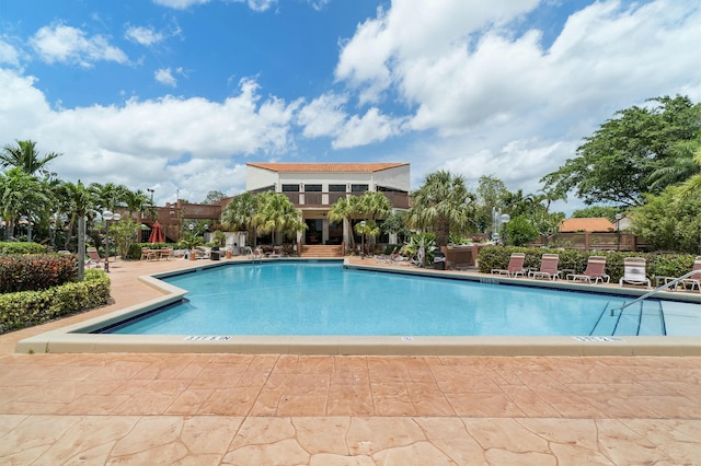 view of swimming pool featuring a patio area