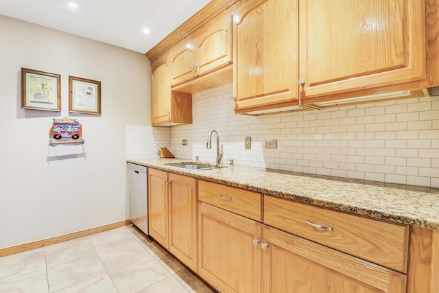 kitchen featuring sink, light tile patterned floors, dishwasher, light stone counters, and tasteful backsplash