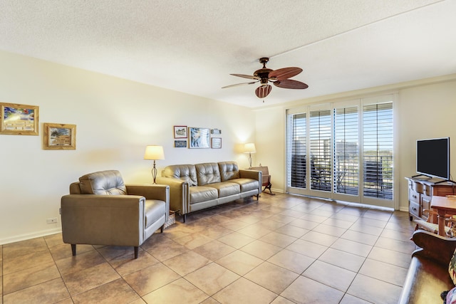 tiled living room with a textured ceiling and ceiling fan