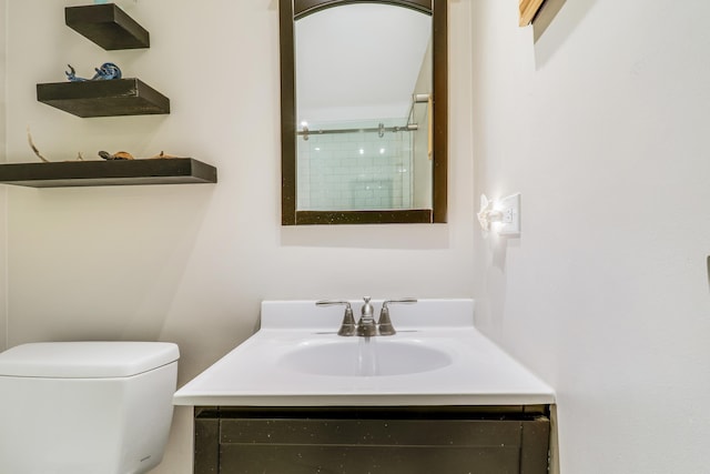 bathroom with vanity and toilet