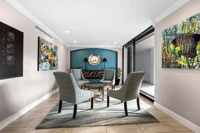 sitting room with crown molding and a textured ceiling