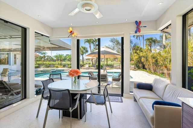 sunroom / solarium with ceiling fan