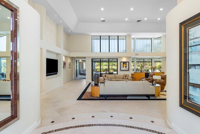 living room featuring a high ceiling