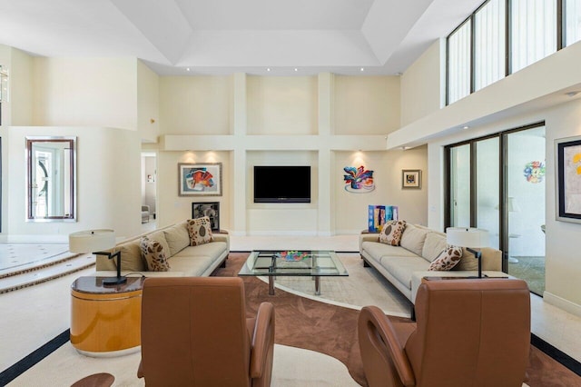 living room featuring a high ceiling