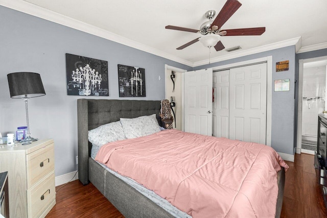 bedroom with dark wood-style flooring, a closet, visible vents, ornamental molding, and baseboards