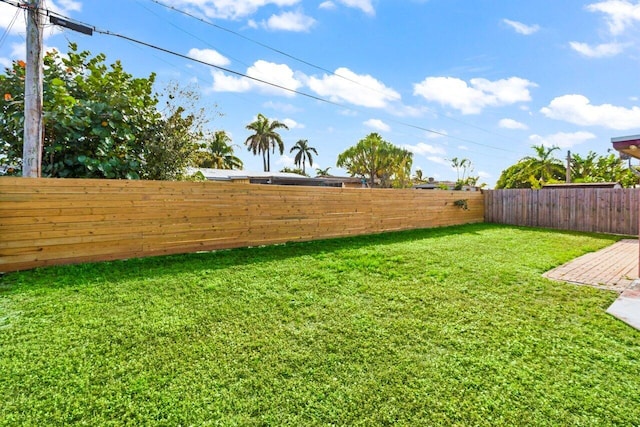 view of yard with a fenced backyard