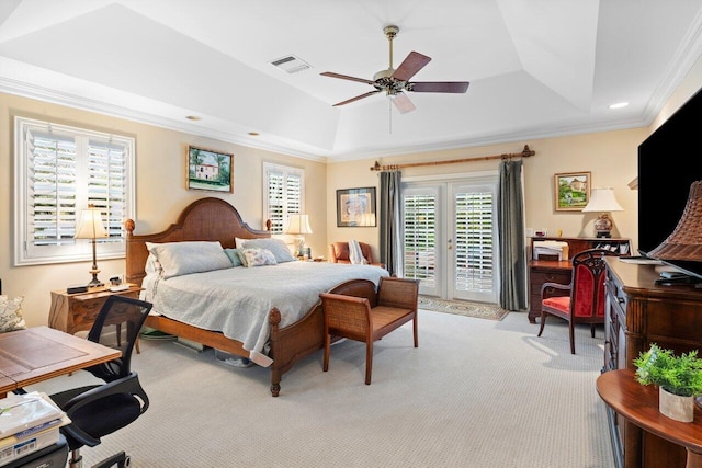 carpeted bedroom featuring crown molding, access to outside, a raised ceiling, and french doors