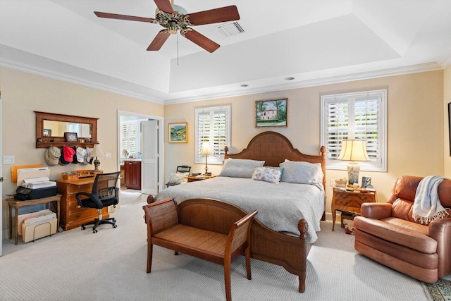 carpeted bedroom with connected bathroom, crown molding, a raised ceiling, and ceiling fan