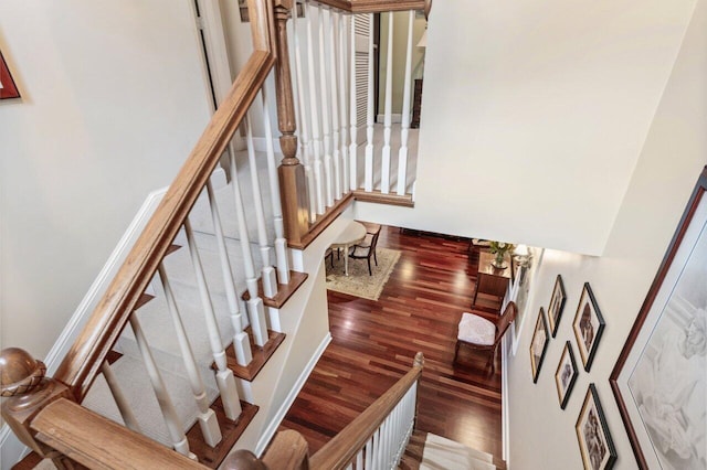 staircase featuring hardwood / wood-style flooring