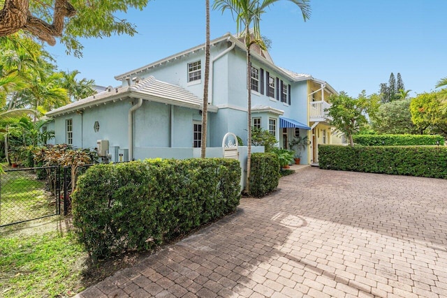 view of property exterior with a balcony