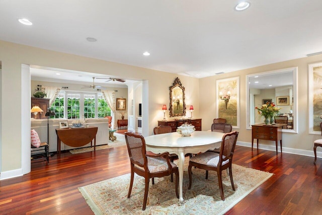 dining space featuring dark hardwood / wood-style flooring and ceiling fan