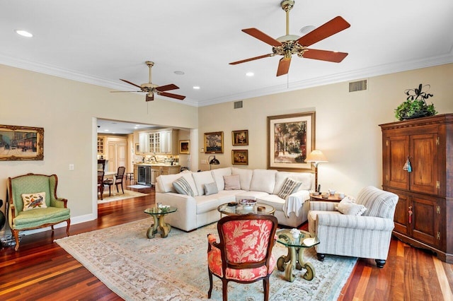 living room with ornamental molding, dark wood-type flooring, beverage cooler, and ceiling fan