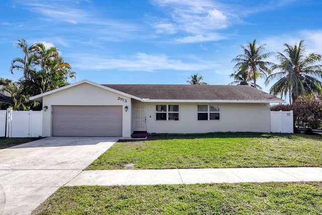 ranch-style home with a garage and a front yard