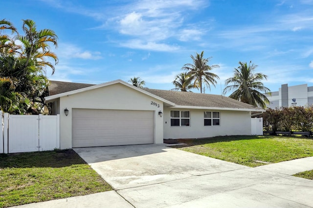 single story home with a garage and a front yard