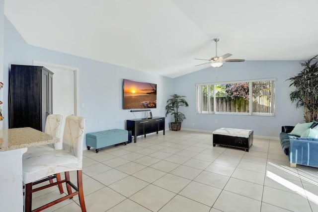 tiled living room with ceiling fan and vaulted ceiling