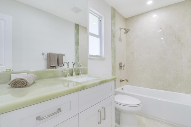 bathroom featuring toilet, vanity, and shower / tub combination