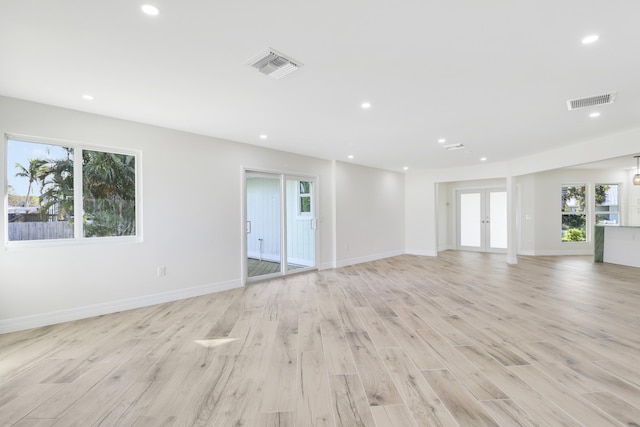 spare room featuring recessed lighting, visible vents, and a healthy amount of sunlight